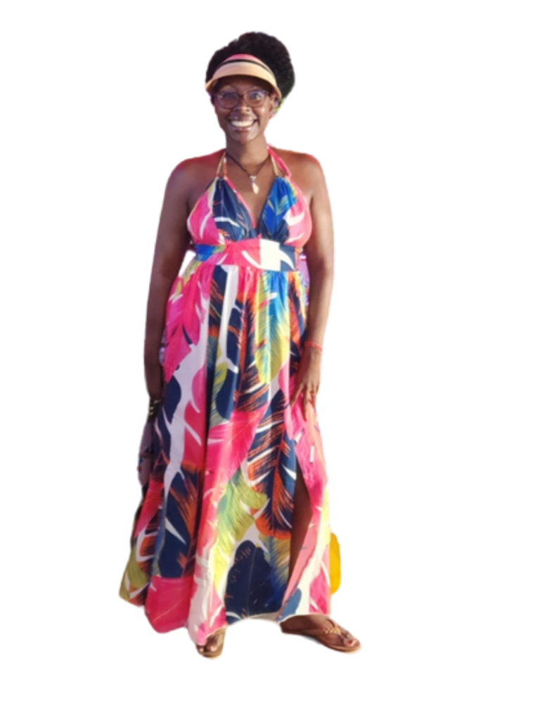 Kaotic Thoughts creator - full body portrait in colorful tropical print dress